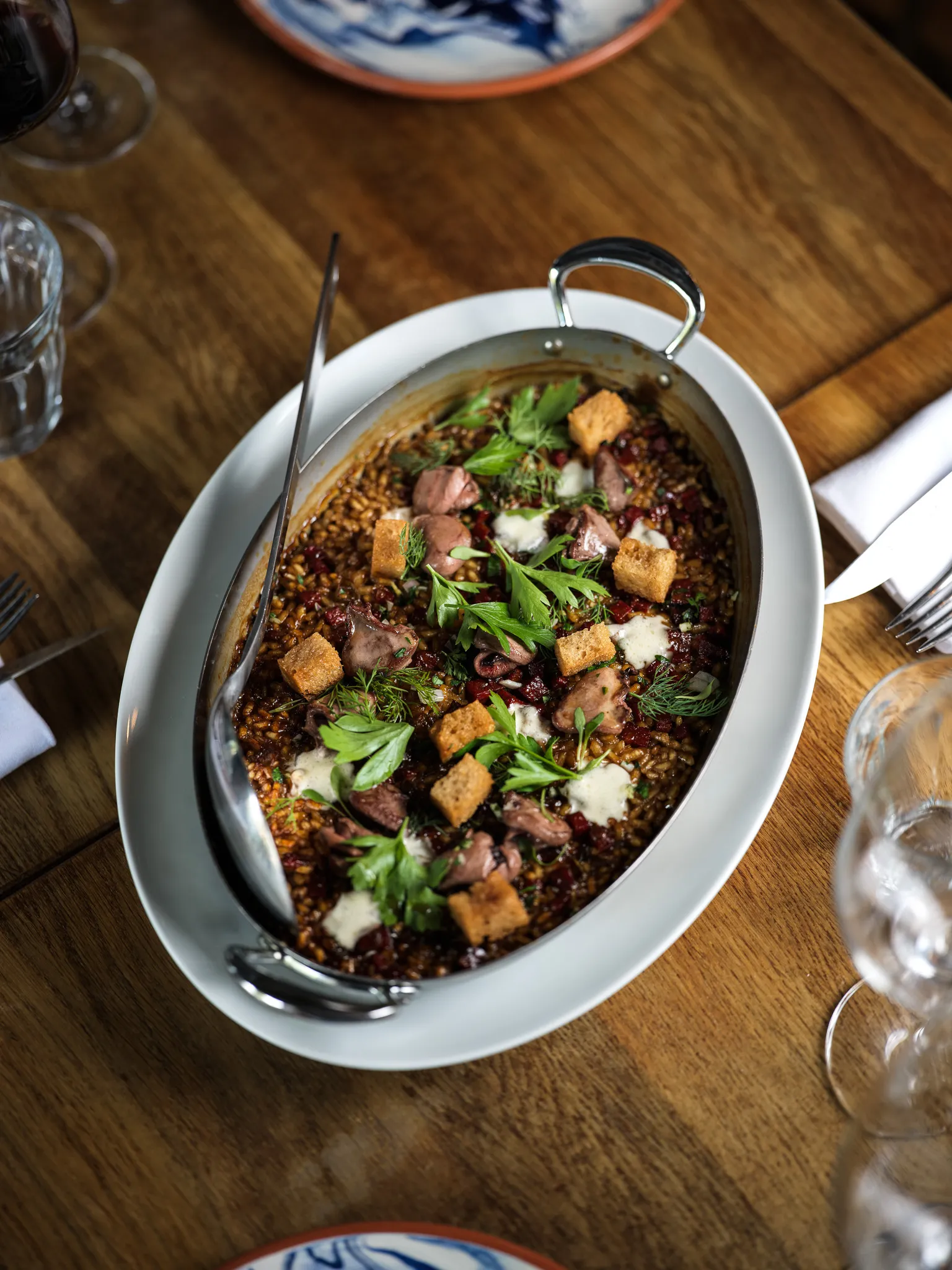 Riz Albufera au canard rôti, condiment soja et noisette
